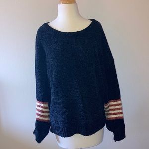Black loose knit sweater with burnt orange stripes